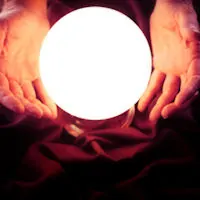 A glowing crystal ball between 2 hands.