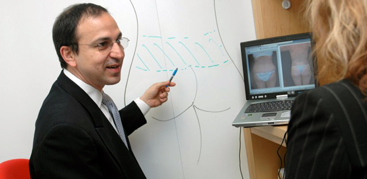 Dr. Ricardo L. Rodriguez standing in front of a whiteboard.