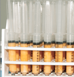 A rack of filled fat tubes.