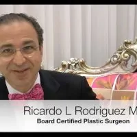 Dr. Ricardo L. Rodriguez sitting in a chair.