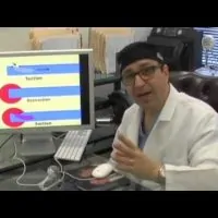 Dr. Ricardo L. Rodriguez sitting behind his desk.