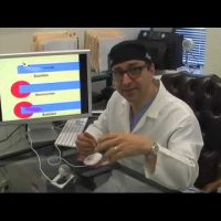 Dr. Ricardo L. Rodriguez sitting behind his desk.