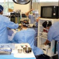 Dr. Ricardo L. Rodriguez, in the operating room, performing cosmetic surgery.