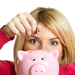A woman saving money in piggy bank.