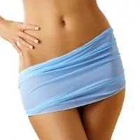A woman's lower body covered by a blue scarf.